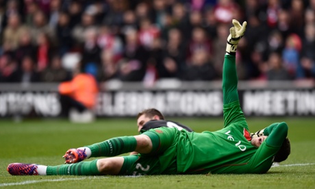 Southampton's Fraser Forster calls for assistance after being injured in a challenge.