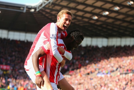 Mame Biram Diouf is congratulated by Stoke team-mate Peter Crouch for notching the opening goal of the game