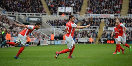 Olivier Giroud celebrates scoring his team's first goal with his team-mates.