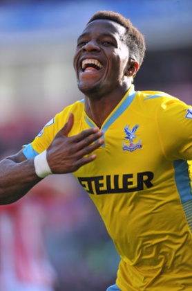 Crystal Palace's Wilfried Zaha celebrates scoring their second goal.