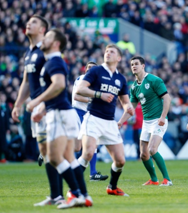 All eyes are one the ball as Ireland's Jonathan Sexton conversion thumps against the post.