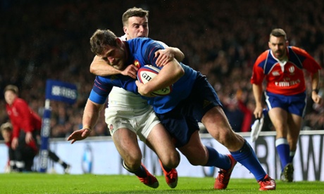 Vincent Debaty beats the tackle of George Ford to score France's fourth try.