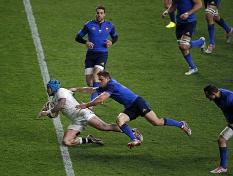 England wing Jack Nowell breaks a tackle to score.