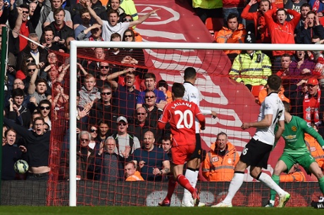 Adam Lallana knocks his chance wide.