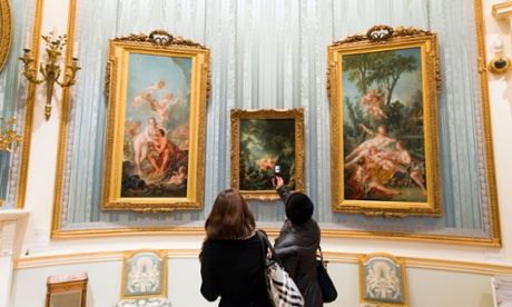 Visitors taking photos of paintings using a camera phone at the Wallace Collection art gallery, London, England, Britain.
