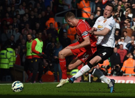 Jordan Henderson is fouled by Phil Jones.