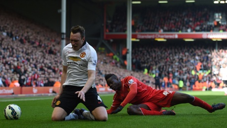 Mario Balotelli is boked for his challenge on Phil Jones.