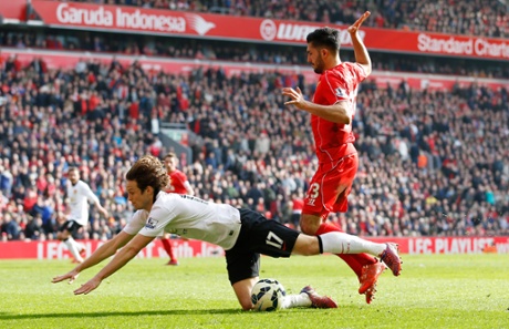 Daley Blind is brought down in thebox by Emre Can.