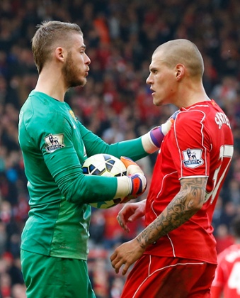 Martin Skrtel clashes with David De Gea.