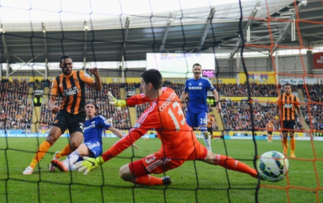 Ahmed Elmohamady shoots past goalkeeper Thibaut Courtois of Chelsea to score Hull's first.