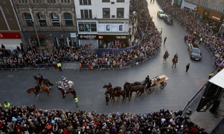 The coffin containing the remains of King Richard III is carried in procession.