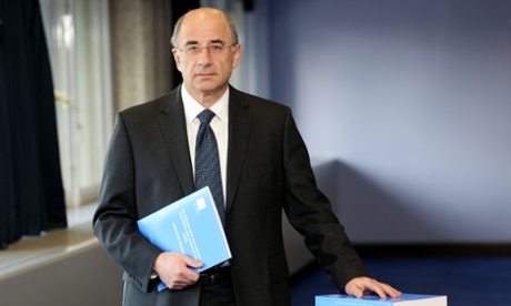 Lord Leveson with his report.