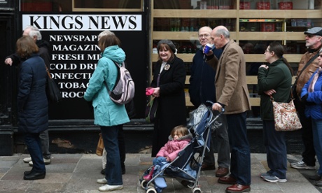 Crowds queue outside the Kings News.