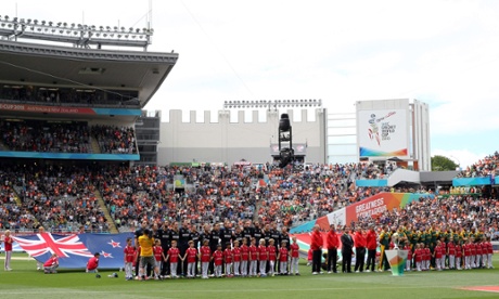 The two teams line up for the national anthems.