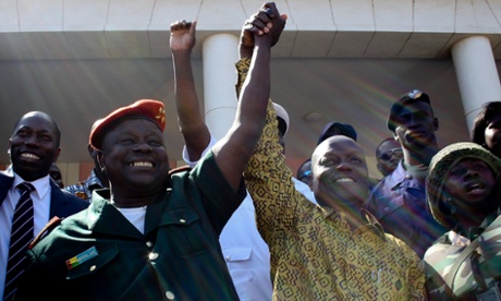 Chief of State Major of Army of Guinea-Bissau Antonio Indjai (L) celebrates the victory of the candidate of PAIGC party to Presidency Jose Mario Vaz (R) after being declared winner of the elections, in Bissau, Guinea-Bissau, 20 May 2014. Jose Mario Vaz won the elections against independent candidate Nuno Gomes Nabiam according to provisional results announced by the National Elections Commission.