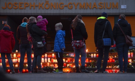 Well-wishers at a memorial in front of the school that is believed to have lost 16 students and two teachers in the crash.