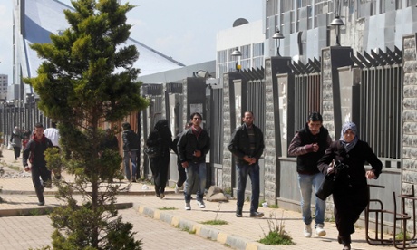 Civilians run  in Homs