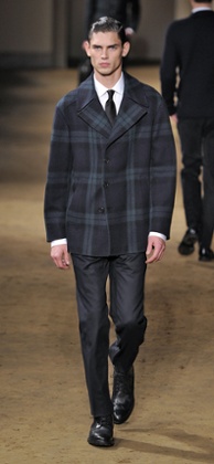 A model in oversized checks on the Corneliani AW14 catwalk show in Milan