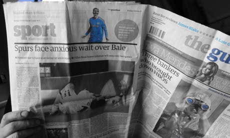 Reading the Guardian.