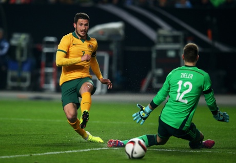 Matthew Leckie shoots wide past Ron-Robert Zieler of Germany.