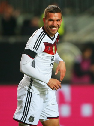 Lukas Podolski celebrates as he scores Germany's second.