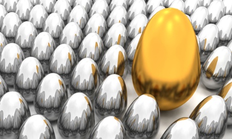 A golden Easter egg among lots of silver eggs