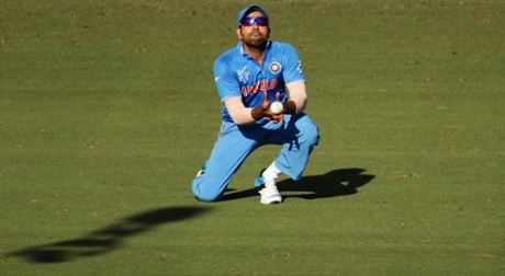 Rohit Sharma of India takes a catch in the deep to dismiss Steve Smith.