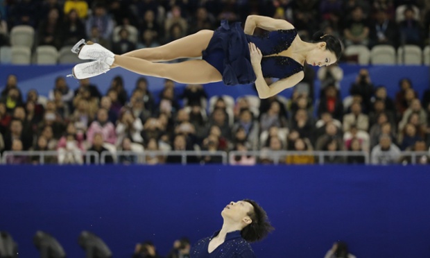 Pang Qing, keeping perfect poise mid-air, and Tong Jian took silver in yesterday's pairs short programme at the ISU World Figure Skating Championships in Shanghai. The Chinese veterans came out of retirement to compete on home ice