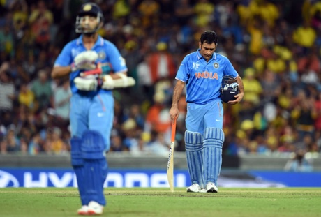 India's captain Mahendra Singh Dhoni, right, reacts after fellow batsman Ajinkya Rahane was dismissed.
