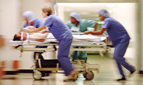 Blurred image of hospital trolley being moved