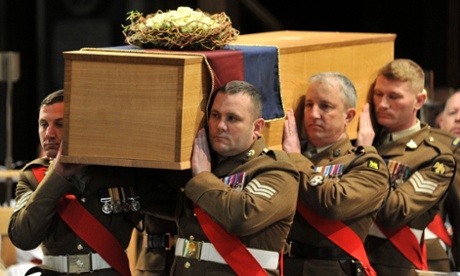 The coffin is carried by the military bearer party during the service for the re-burial of Richard III at Leicester cathedral.