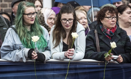 Members of the public gather outside Leicester Cathedral for the ceremony.