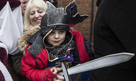 Four-year-old Torin Weston, dressed as Richard III, waits with his grandmother outside Leicester Cathedral.