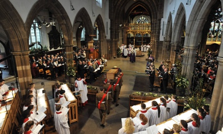 Richard III's coffin is carried by the military bearer party into Leicester Cathedral.
