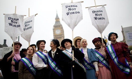 Feminist activists dressed as Suffragettes, women who historically demanded the right to vote, protest opposite the Houses of Parliament for women's rights and equality in October 2012.