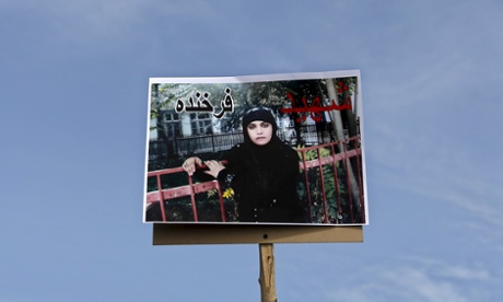 A picture of Farkhunda, an Afghan woman who was beaten to death and set alight on fire on Thursday, is seen during her funeral ceremony in Kabul March 22, 2015.