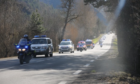 Buses transporting families,escorted by French policemen, arrive in Seyne.