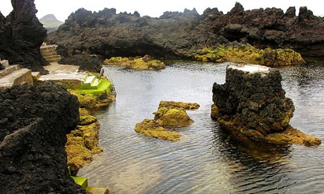 Natural swimming pools carved into the rock at Biscoitos on Terceira island, Azores.