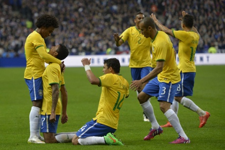Luiz Gustavo is congratulated by teammates after scoring.