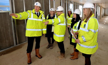 Lots of pointing: David Cameron in a high-vis jacket