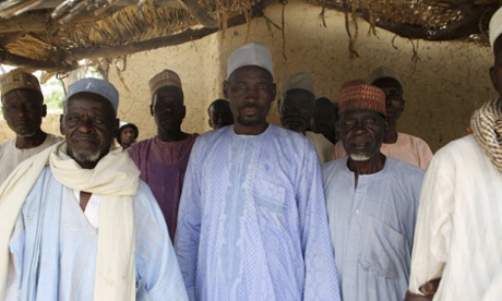 Men who survived Boko Haram occupation of Damasak where 400 women and children were allegedly kidnapped, pose for a picture.