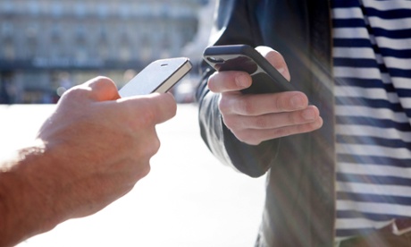 Two people using their smartphones