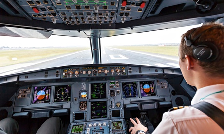 A pilot in the cockpit of an aeroplane