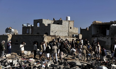 People search for casualties at a bomb site near an air base in Sana’a, Yemen.