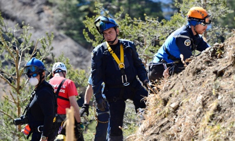 Gendarmes, forensics and rescuers working at the crash site of the Germanwings Airbus A320 near Le Vernet, French Alps.
