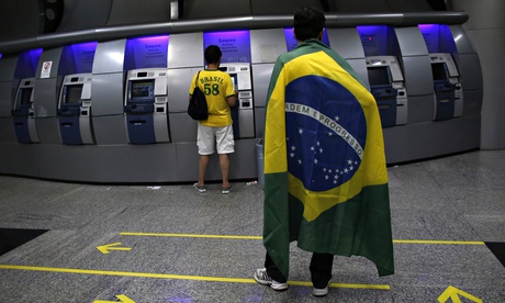 Brazilians at an ATM machine