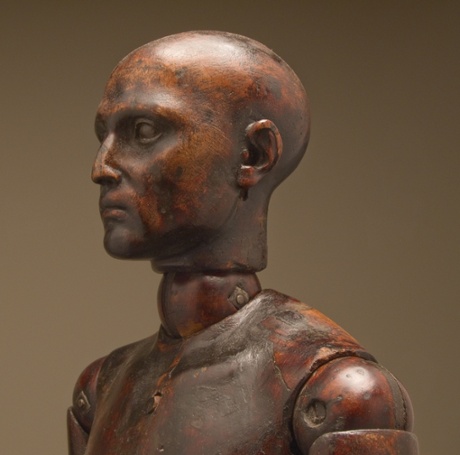 From her wooden sleep.