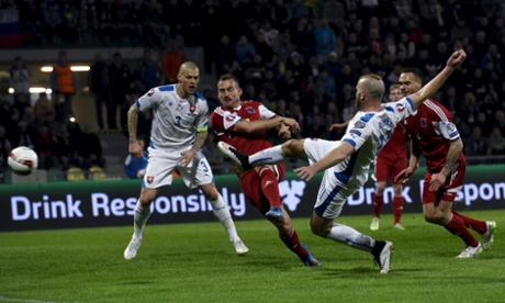 Slovakia's Adam Nemec, second right, opens the scoring against Luxembourg.