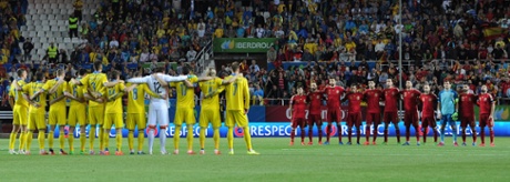 The Spanish and Ukrainian players pay their respects to the victims of the aircraft that crashed in the French Alps.