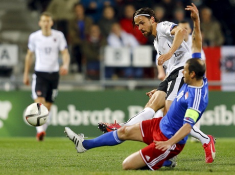 Austria's Martin Harnik opens the scoring past Liechtenstein's Mario Frick.
